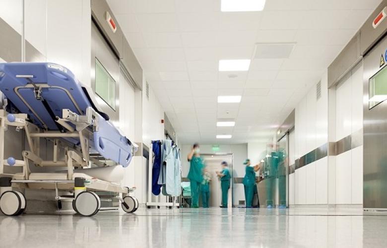 Hospital staff standing in a hospital corridor
