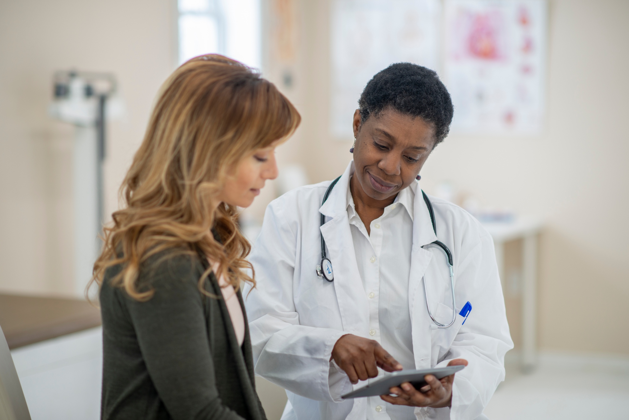 A doctor talking to a woman