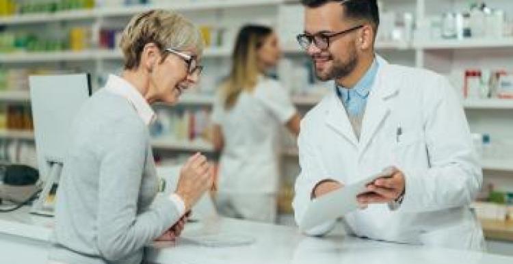 Pharmacist helping a women