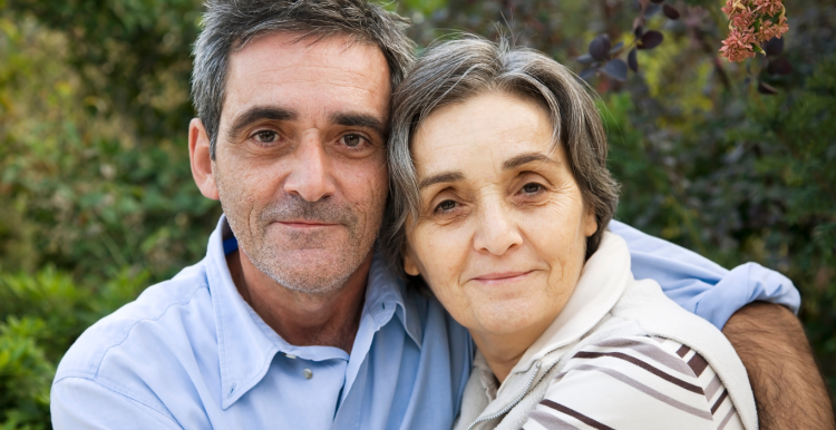 A man and a woman looking at the camera