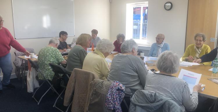 A group of people sitting around a table