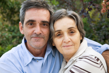 A man and a woman looking at the camera