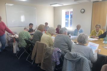 A group of people sitting around a table