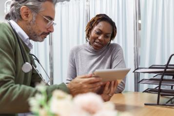 A doctor talking to a woman